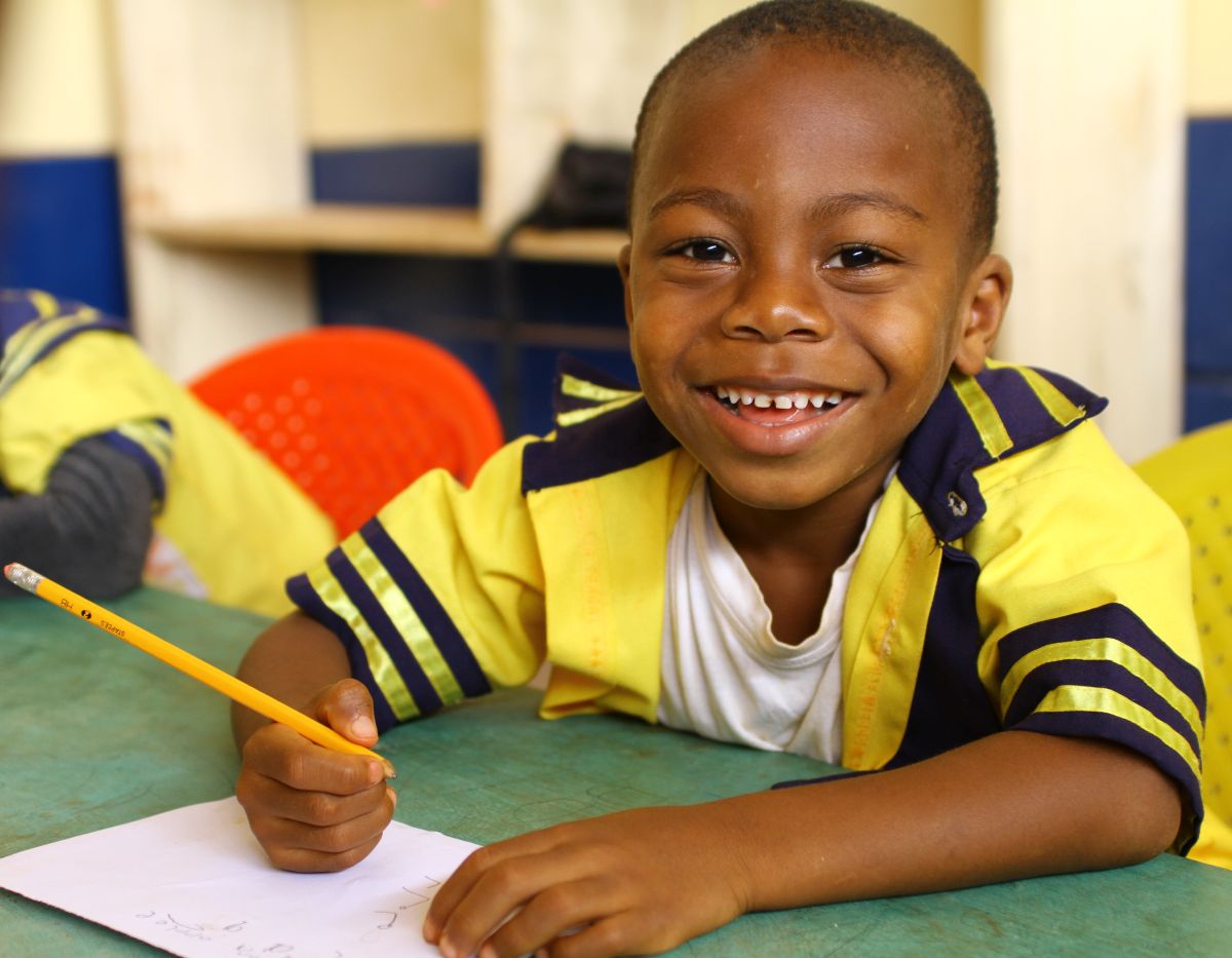 boy in Cameroon with pencil